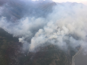 Smoke rises from the 200-acre McHugh Fire south of Anchorage along the Seward Highway on Monday night. (Alaska Division of Forestry photo)