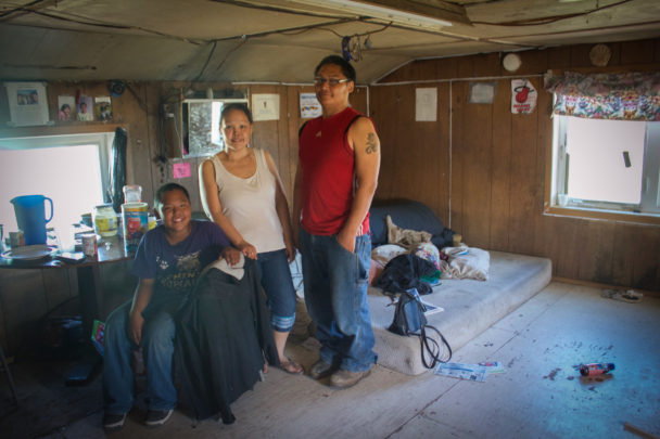 Minnie Pete, her husband, Bernard Pete, and their eldest son inside their home in Stebbins. (Photo by Emily Russell, KNOM - Nome)