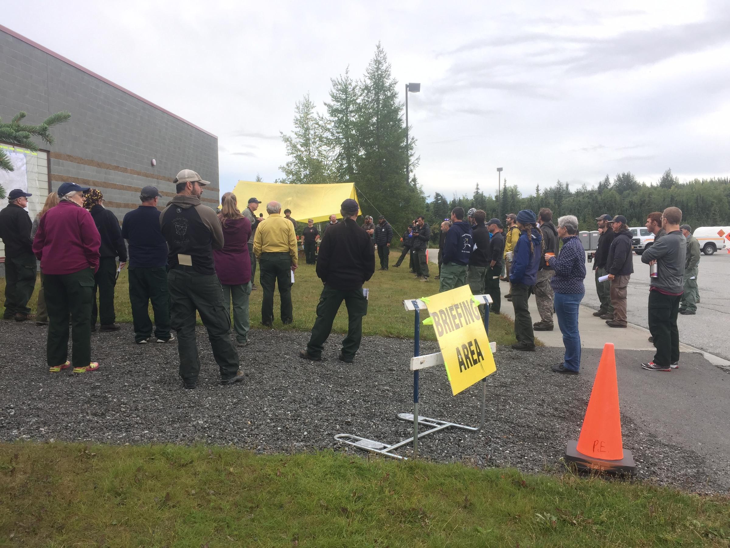 Fire responders at the McHugh fire daily briefing Tuesday morning. Alaska's Chena, Tanana Chiefs Conference and White Mountain firefighter crews are mopping up hot spots. (Photo by  Joaqlin Estus, KNBA - Anchorage)