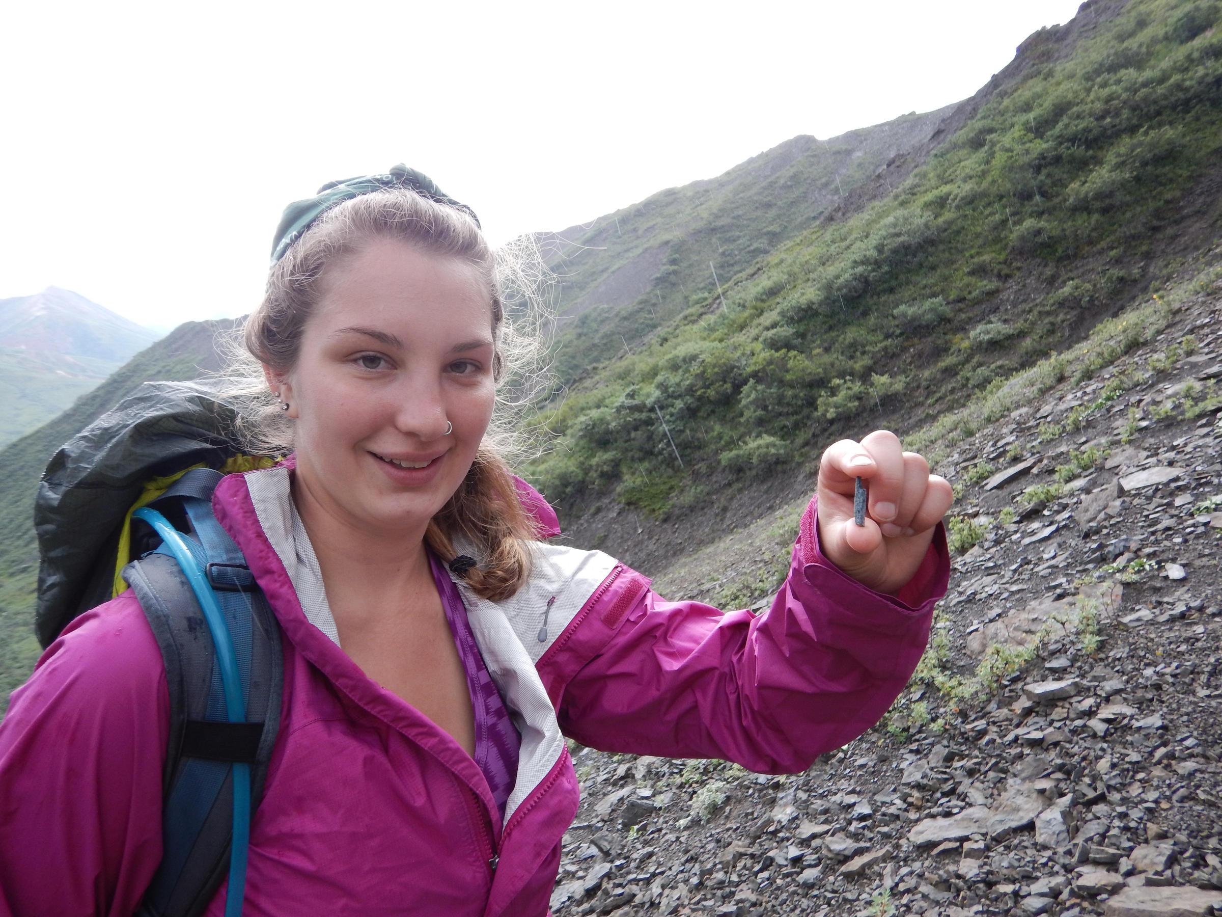 UA Museum of the North curatorial intern Heather MacFarland, who found the first bone, at the site of the discovery in Denali National Park (Photo courtesy of UA Museum of the North)