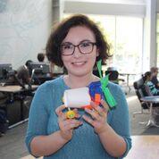 Homer High School Senior Eryn Gillam holds a motorcar that she and her group designed during a STEM lab. (Photo Courtesy of ANSEP)
