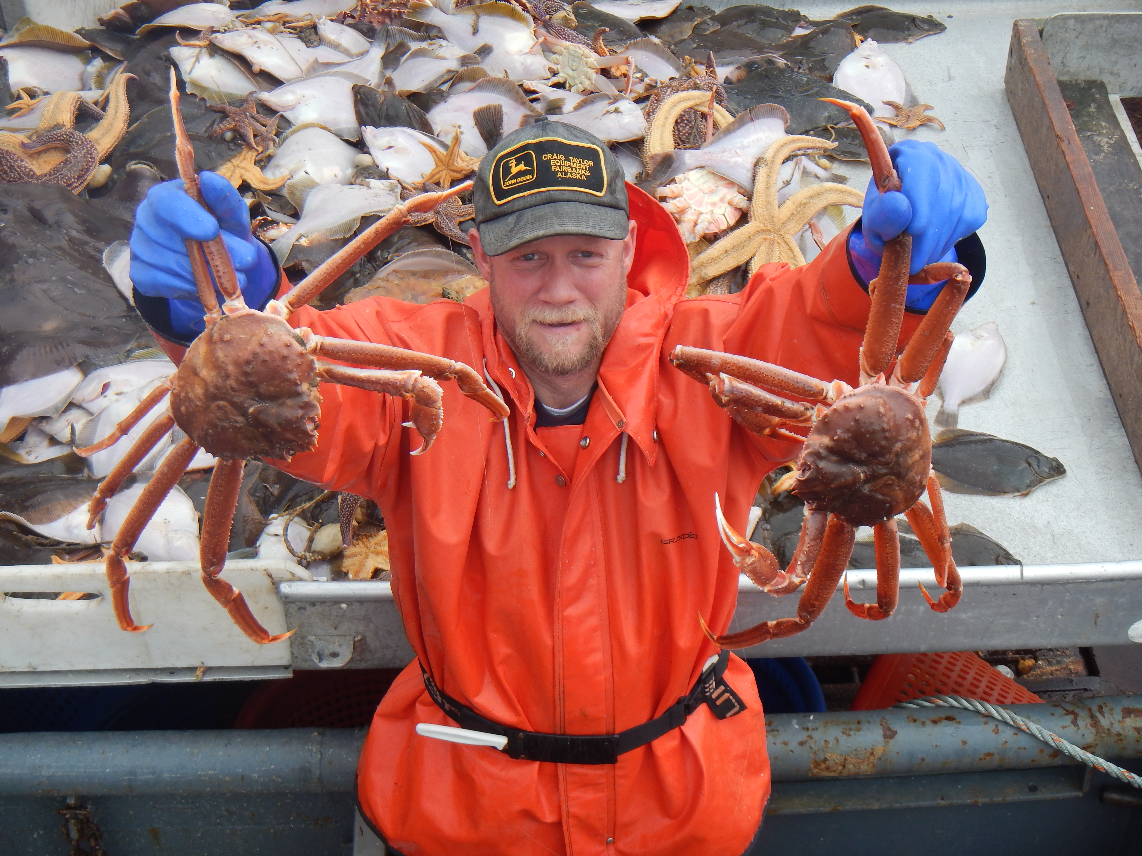 Bob Foy, director of the NOAA lab in Kodiak, holds up king crab, a species expected to be impacted by ocean acidification. (Photo courtesy NOAA’s Fisheries Science Center)