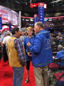 Tuckerman and Kristie Babcock chat with Alaska delegate Jerry Ward in a lighter moment on convention floor. Photo: Liz Ruskin
