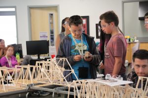 Students prepare to test their bridges at the ANSEP Middle School Academy. (Photo by Ammon Swenson, Alaska Public Media- Anchorage)