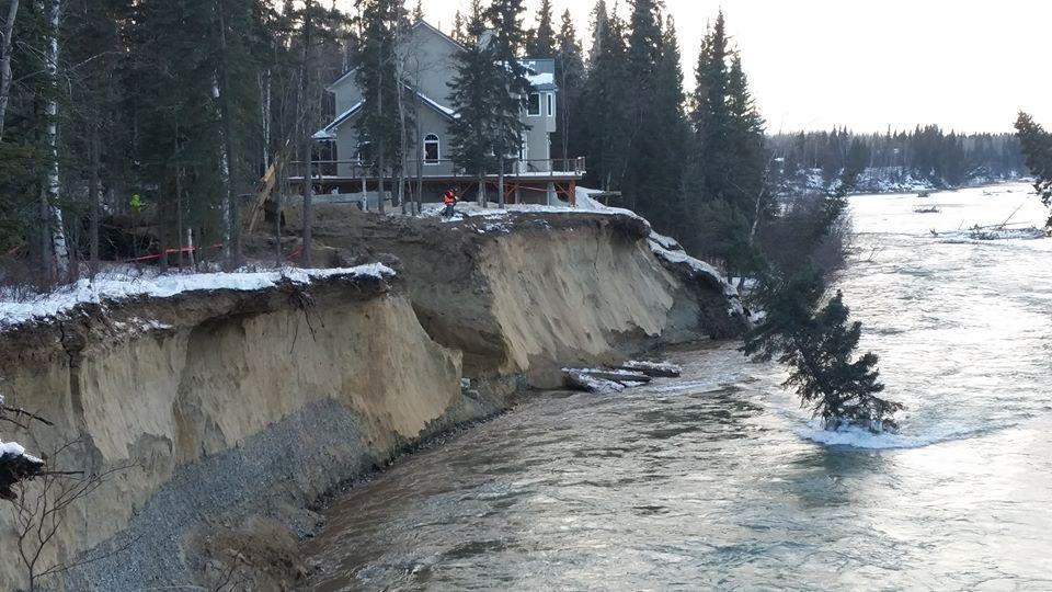 Water diverted from the Tanana River main channel by an ice dam in January blew away vegetation, gouged out the slough and washed away much of the bank at the foot of a ridge where Tom Gorman built his home. (Photo courtesy of Tom Gorman)