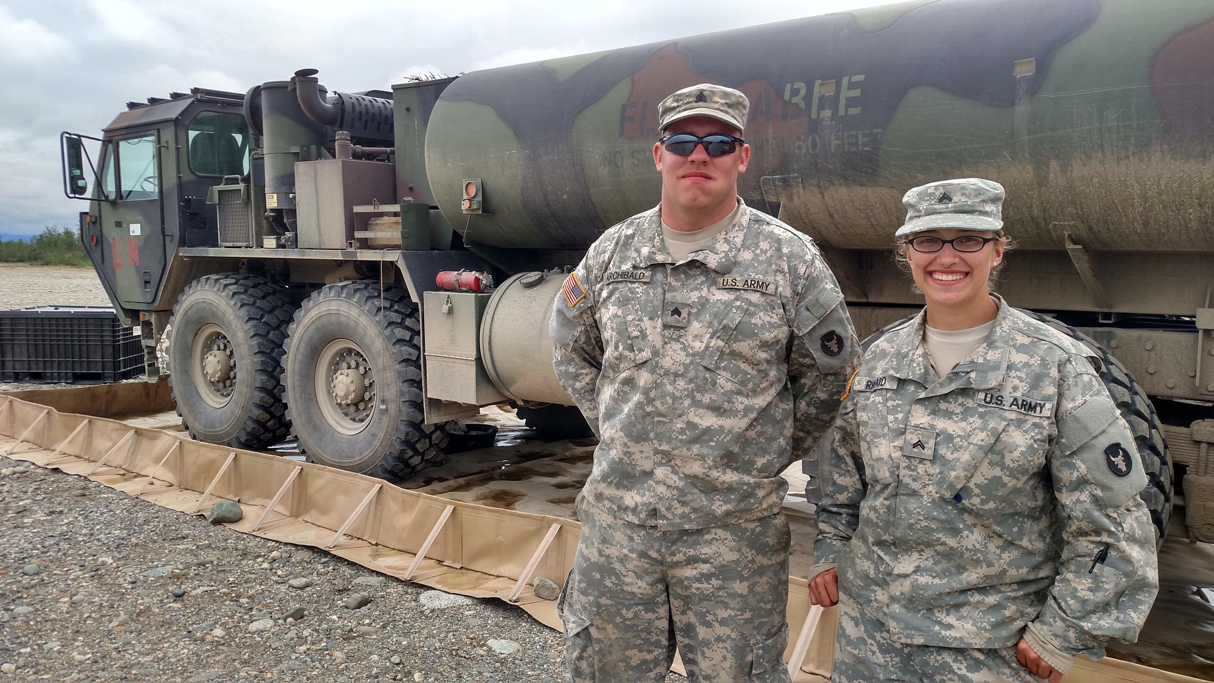 Iowa Guard Cpl. Lacey Richards, right, and Sgt. Tyler Archibald at a fueling point on a training range near Fort Greely. (Photo by Tim Ellis, KUAC - Fairbanks)
