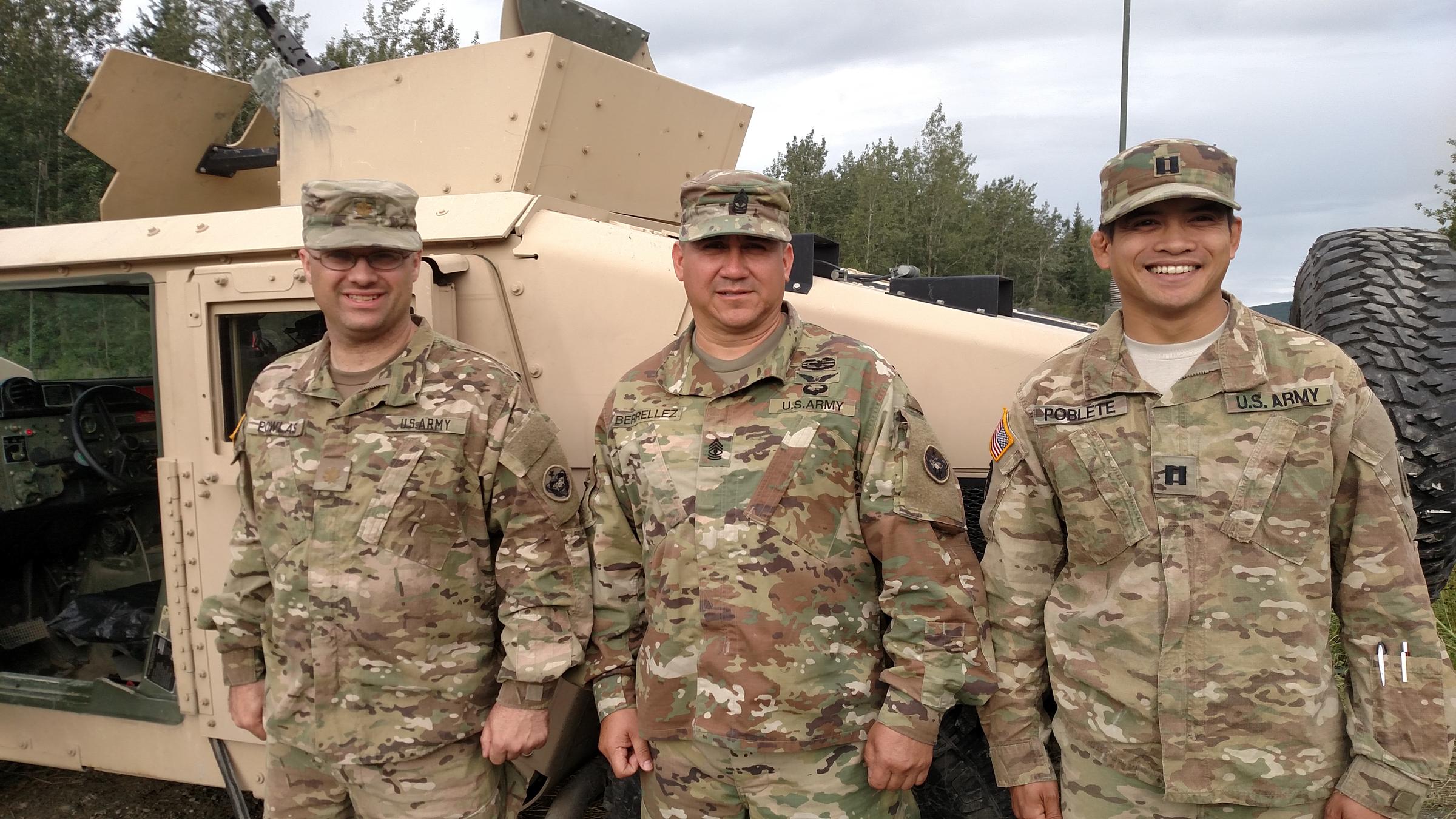 Fort Wainwright soldiers who helped handle Arctic Anvil logistical support, from left: Maj. Tim Powlas, 17th Combat Sustainment Battalion; Ist Sgt. David Barrellez, 539th Transportation Company; Capt. Joshua Poblete, 574th Composite Supply Company. (Photo by Tim Ellis, KUAC - Fairbanks)