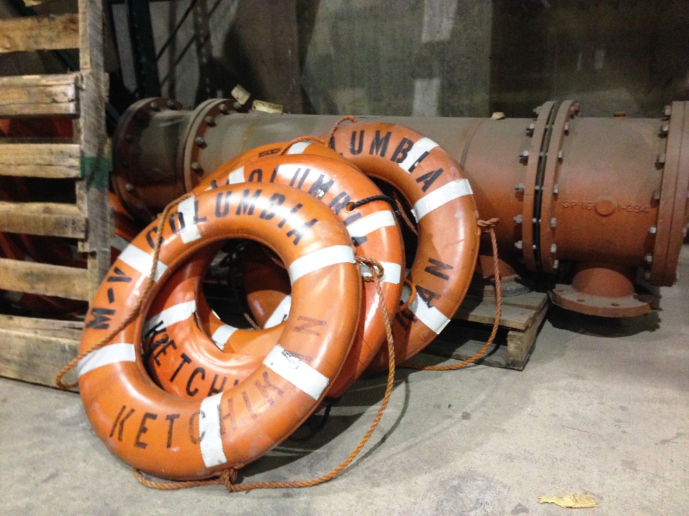 Extra ferry life rings lean against other spare parts at the Ketchikan Marine Engineering Facility at Ward Cove in 2014. (Photo by Ed Schoenfeld, CoastAlaska News - Juneau)