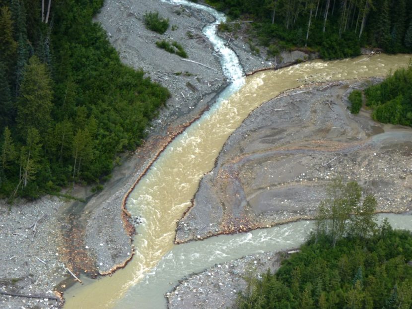 Sulphurets Creek, which drains naturally occurring rusty water from the KSM mine prospect, enters the Mitchell Creek upstream from Southeast Alaska. Tribal officials worry mining will send polluted water into British Columbia rivers that flow into Alaska. KSM officials say their pollution-control designs will keep that from happening. (Photo by Ed Schoenfeld, CoastAlaska News - Juneau)