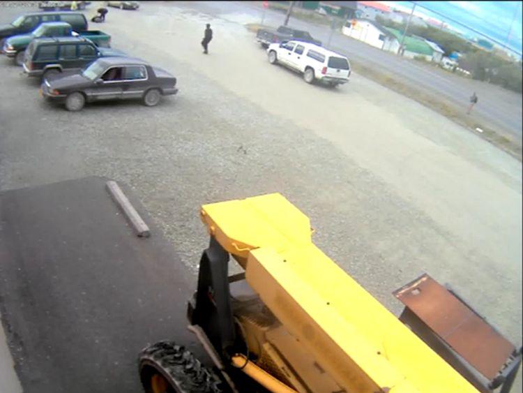 Still image from Alaska Commercial Company security camera showing Andrew Reid assaulting Mr. Gregory.