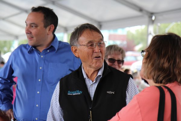 Joseph Chythlook talks with attendees at a community cookout hosted by the Bristol Bay Native Corporation celebrating Salmon Day in Anchorage on August 10. (Photo by Graelyn Brashear - KSKA/Anchorage)