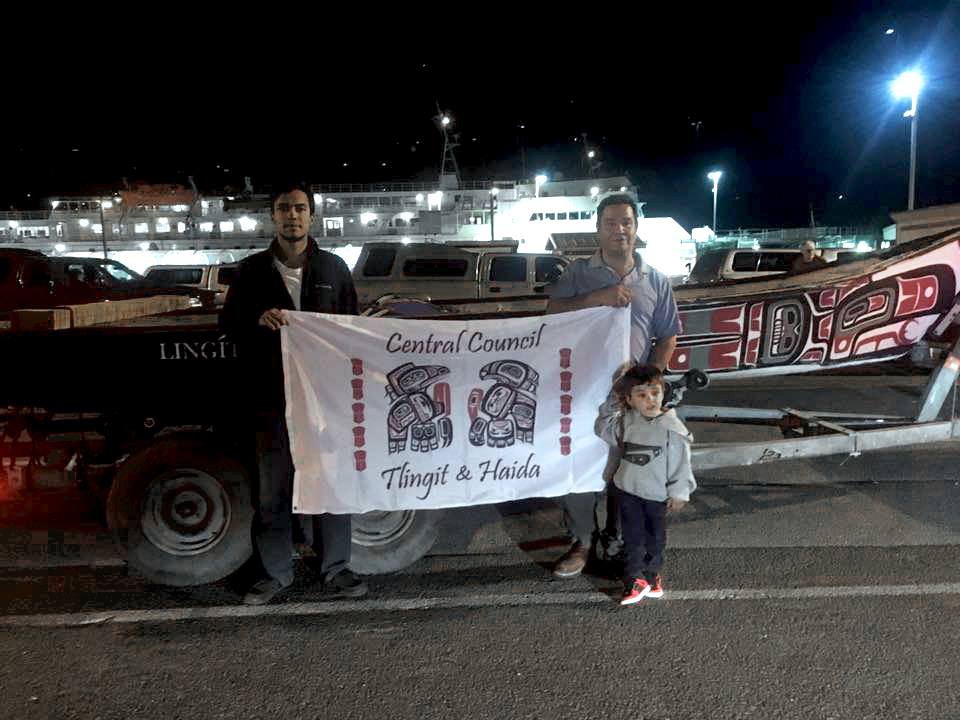 Doug Chilton and DeAndre King in front of the canoe they’ll take to North Dakota. (Photo courtesy of Central Council of Tlingit and Haida Indian Tribes of Alaska)