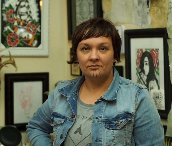Holly Mititquq Nordlum at Above The Rest tattoo shop in Anchorage where she's working to meet the state's official requirements to be eligible for getting a tattoo license. Photo: Zachariah Hughes, Alaska Public Media - Anchorage.
