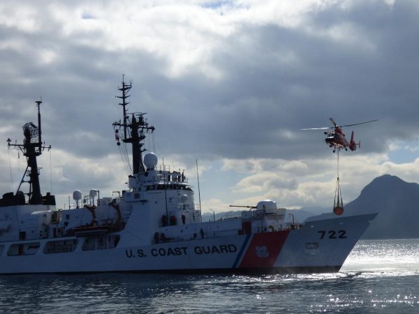 A helicopter practices dropping an Emergency Towing System on the Coast Guard cutter Morgenthau. Photo by Zoe Sobel/KUCB.