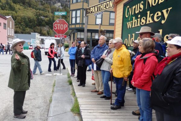 Park ranger Charlotte Henson leads a group of visitors on a walking tour of Skagway focused on the story of Company L. Photo by Emily Files/KHNS. 