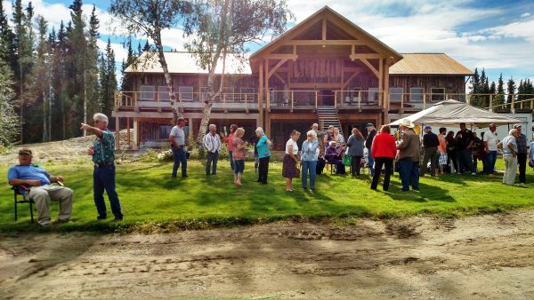 Even before owner Kevin Ewing opened the new Clearwater Lodge, dozens of area residents and visitors gathered in the back yard for a family celebration. The new facility opened Sept. 3. (Photo by Tim Ellis/KUAC)