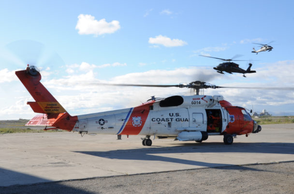 A Coast Guard MH-60 Jayhawk rescue helicopter (foreground) in Kotzebue, Alaska, in August 2010. (Photo by Petty Officer 3rd Class Walter Shinn, U.S. Coast Guard)