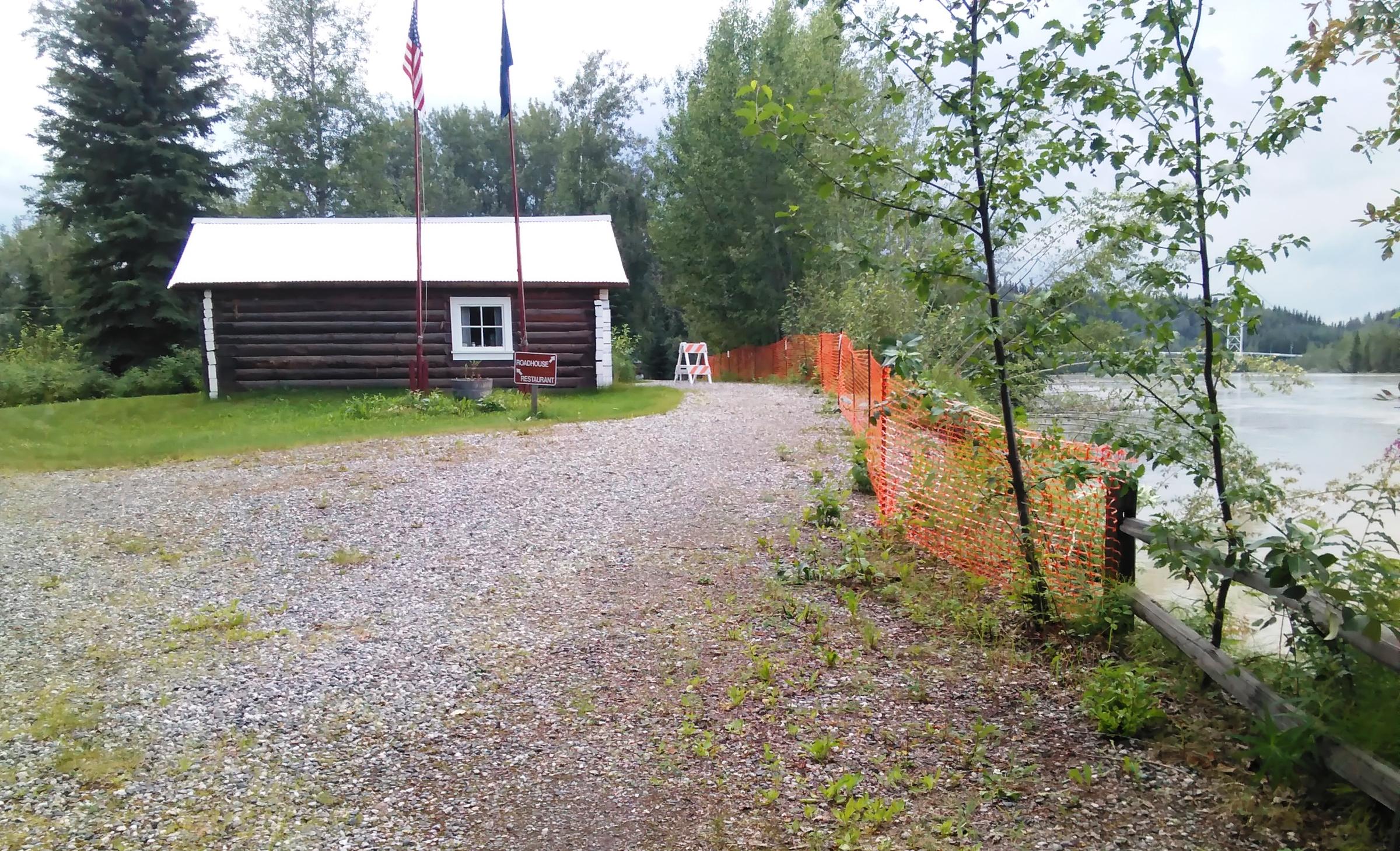 Alaska State Parks is trying to raise money for a riverbank-stabilization project that would halt the Tanana River from washing away the bank that's already been eroded to within 13 feet of this historic cabin at Big Delta State Historical Park. (Photo courtesy of Monica Gray - Alaska State Parks)
