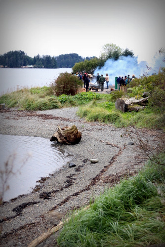 The steaming on Sitka’s Eagle Beach attracted friends and family of the carvers along with Park Service employees. (Photo by Emily Russell, KCAW - Sitka)