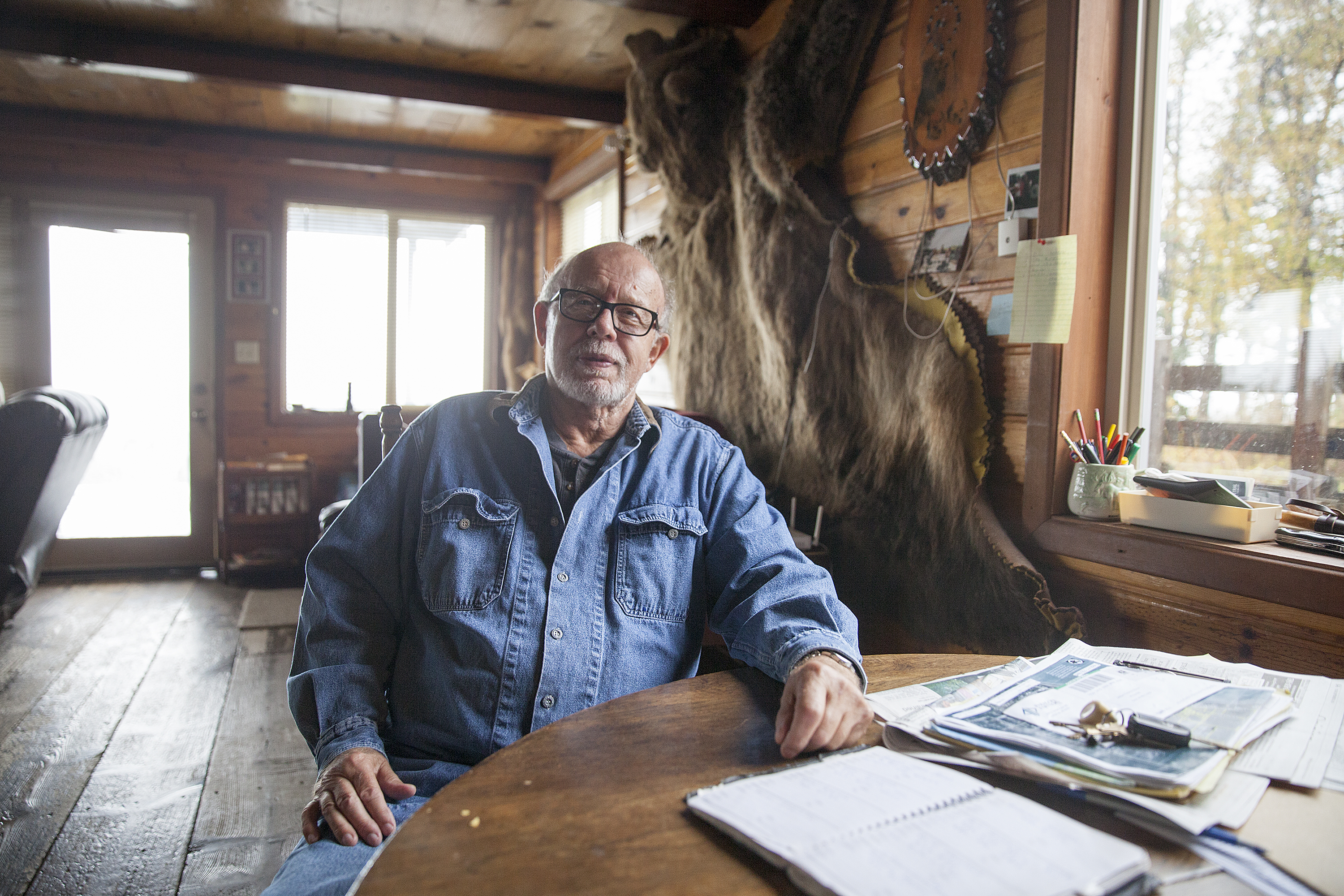 Bill Warren, in the home on land he says he was negotiating to sell to the Alaska LNG project on Sept. 25, 2016 in Nikiski, Alaska. Warren, and others in Nikiski, say they are unsure what will happen to their land as the project transitions to state control. (Photo by Rashah McChesney, Alaska’s Energy Desk - Juneau)
