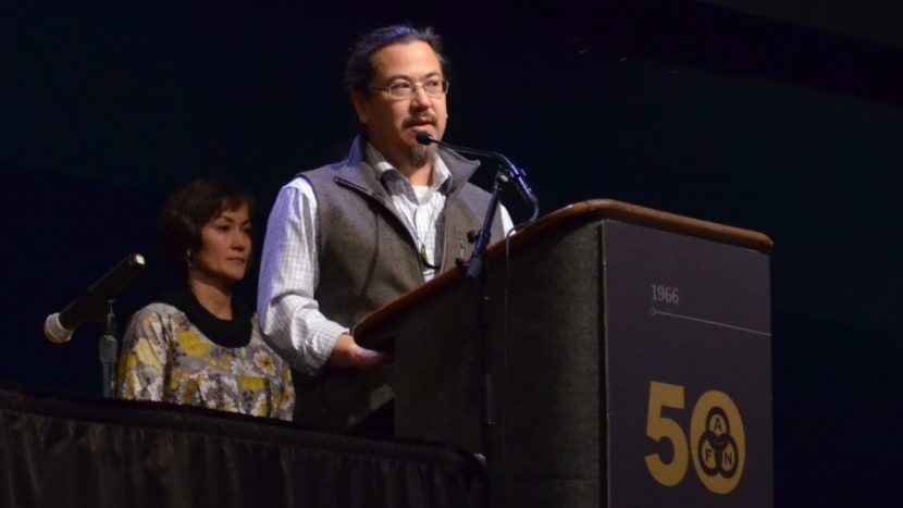 Joe Nelson withdrew his candidacy for co-chair of the Alaska Federation of Natives board at the 2016 convention. Behind him is co-chair Ana Hoffman. (Photo by Jennifer Canfield, KTOO - Juneau)