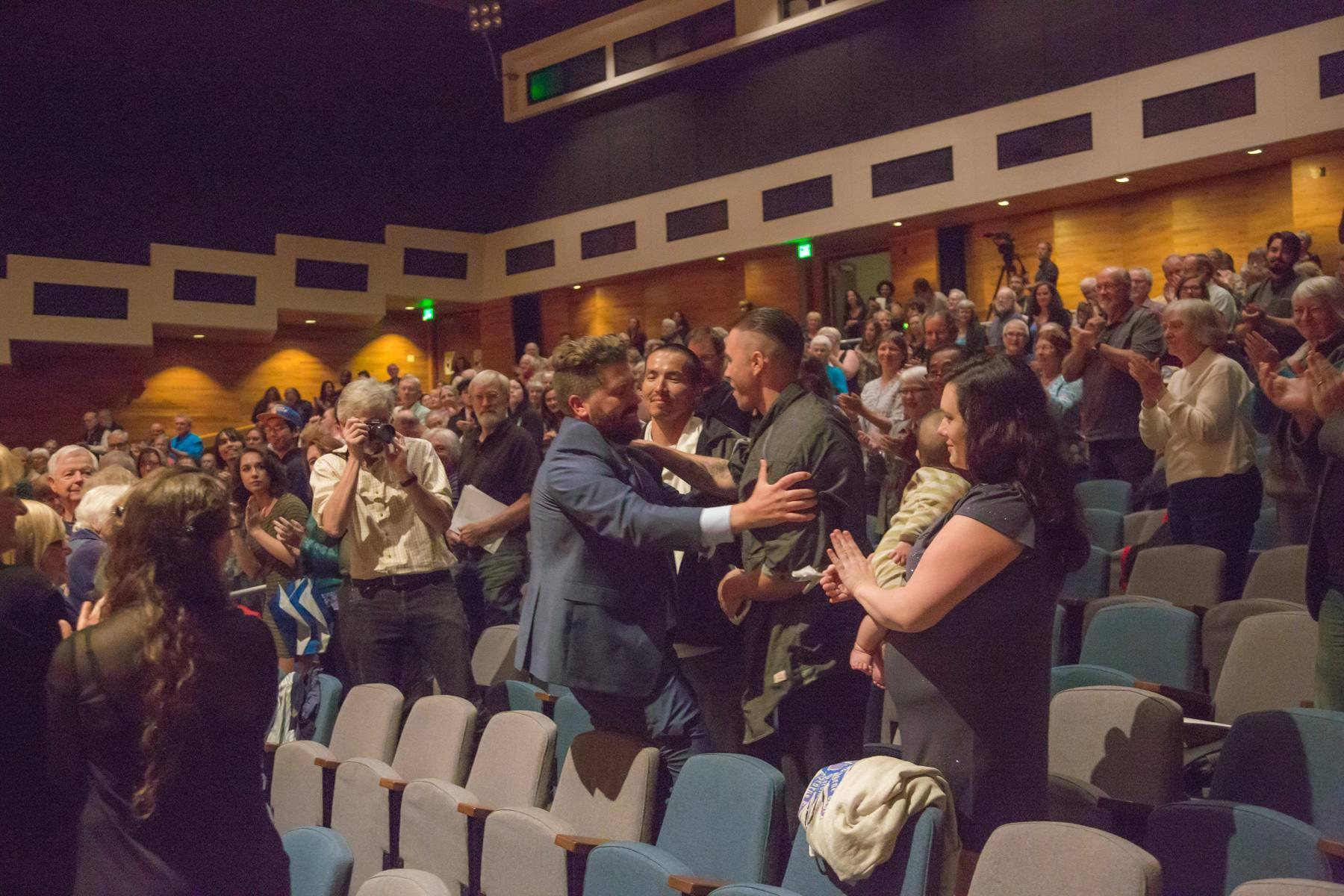 Emerson Eads greets the Fairbanks Four and their family members after the "Mass for the Oppressed" world premiere. (Photo courtesy of UAF)