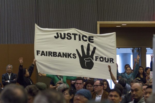 A Fairbanks Four banner at the 2015 Alaska Federation of Natives Conference. (Photo by Mikko Wilson/KTOO)