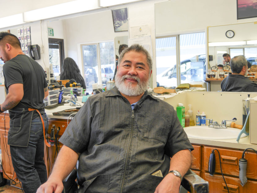 Gerry Carrillo Sr. sits in his barber’s chair at at his barbershop. He’s owned Gerry’s Barbershop for nearly 30 years. (Photo by Lakeidra Chavis, KTOO - Juneau)