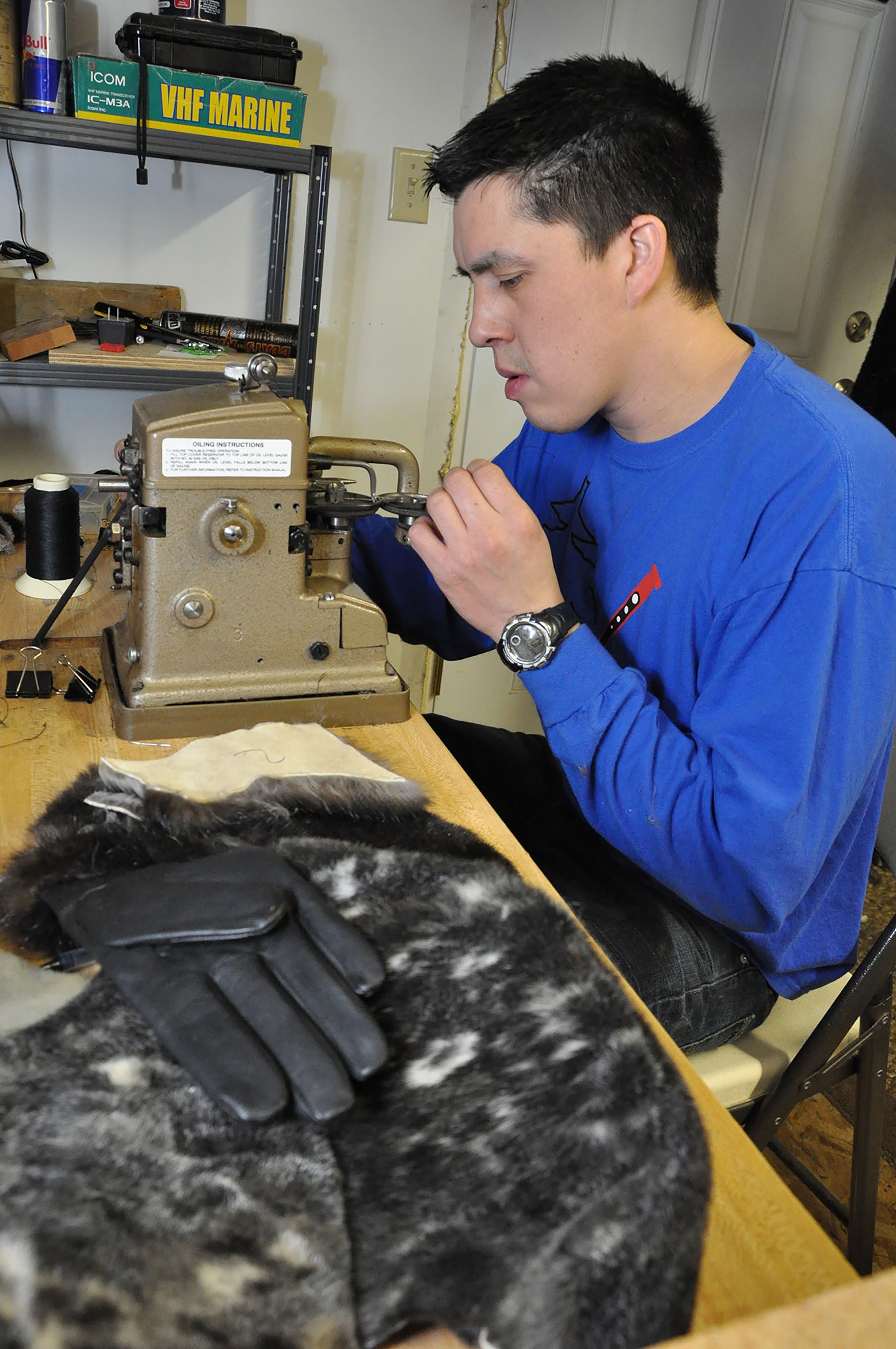 Jeremiah James learns to sew marine mammal furs at a workshop sponsored by the Sealaska Heritage Institute. (Photo courtesy Kathy Dye/Sealaska Heritage Institute)
