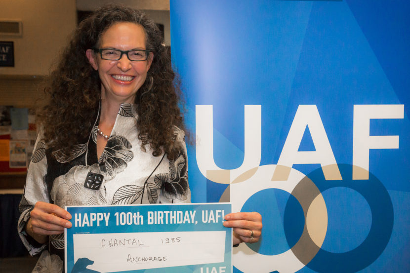 Chantal Walsh poses with a sign wishing the University of Alaska Fairbanks a happy 100th birthday, on Sept. 23, 2016, in Fairbanks, Alaska. Walsh has just been named as the director of the Department of Natural Resources Oil and Gas division. (Photo courtesy JR Ancheta/University of Alaska Fairbanks)