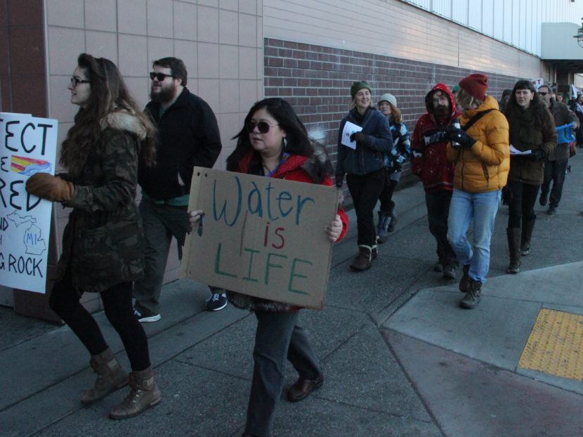 Demonstrators march to the Anchorage 5th Avenue Mall to protest the Dakota Access pipeline project. (Elizabeth Harball, Alaska’s Energy Desk - Anchorage)