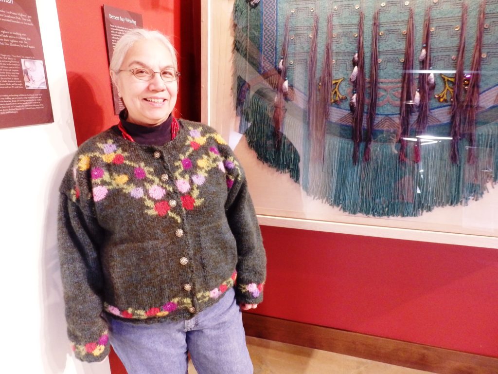 Lani Hotch with her Berners Bay weaving. (Photo by Emily Files, KHNS - Haines)