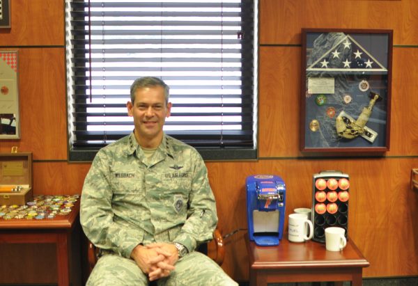 Lieutenant General Kenneth Wilsbach in his office, surrounded by momentos and awards, including a University of Florida Gators coffee-maker. (Photo: Zachariah Hughes, Alaska Public Media - Anchorage)