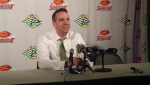 UAA Head Coach Ryan McCarthy speaks at a post-game press conference during the 2016 Great Alaska Shootout. (Photo by Josh Edge/APRN)