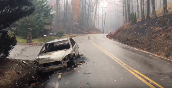 A burned-out car on the side of a road near Gatlinburg, Tenn. (Image from the Tennessee Department of Transportation)