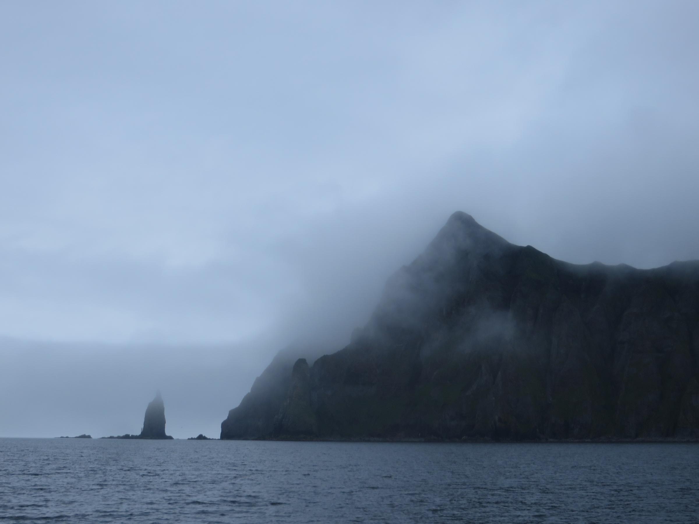 Priest Rock on a foggy day in July. (Laura Kraegel, KUCB - Unalaska)