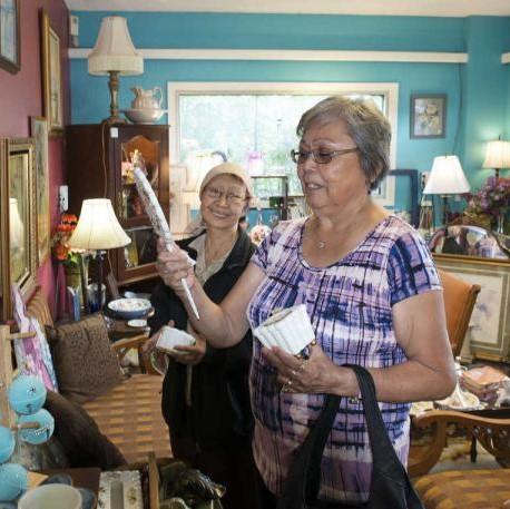 Nancy Nelson (left) and Laura Hobson (right) browse in a local antiques store. The two spend several hours together each week as part of the Kenaitze Senior Companion Program. (Photo courtesy of Kenaitze Indian Tribe)