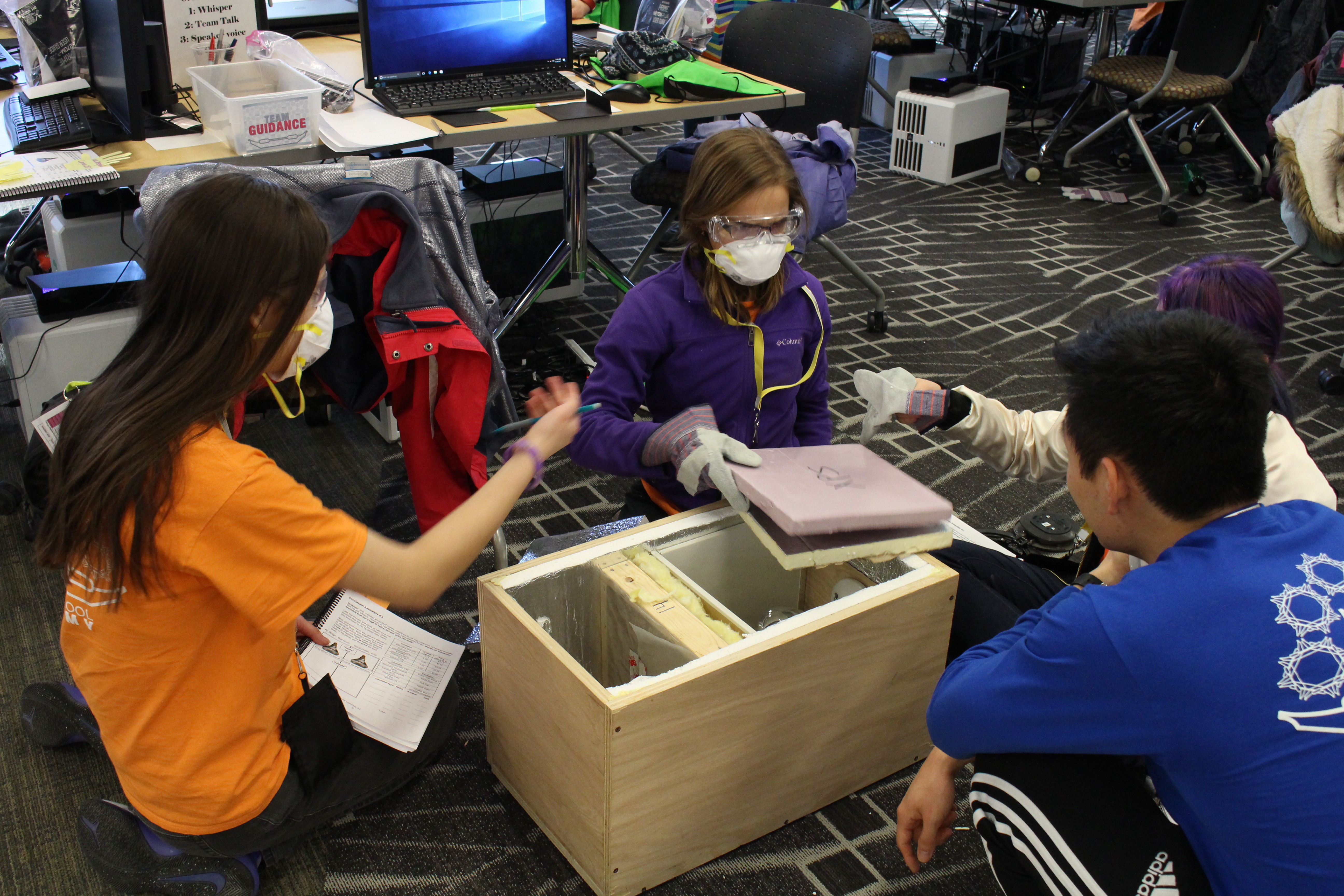 SStudents work on a box