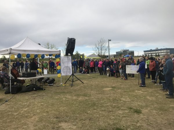 More than 100 people gathered in Anchorage's Cuddy Midtown Park on Saturday, May 20, 2017 to urge lawmakers to preserve education funding. (Photo by Josh Edge/Alaska Public Media)