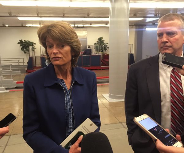 Sens. Lisa Murkowski and Dan Sullivan take questions from reporters in the tunnel under the Capitol.