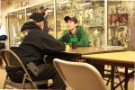 Skipper, Bob Bonanno, interviews potential crew member, Adam Henry, during speed hiring at the Bristol Bay Fish Expo. Credit- Avery Lill, KDLG