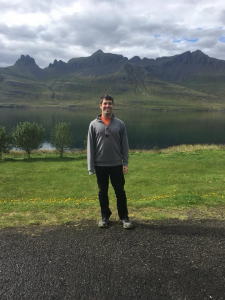 Daniel Cohen standing in front of mountains.