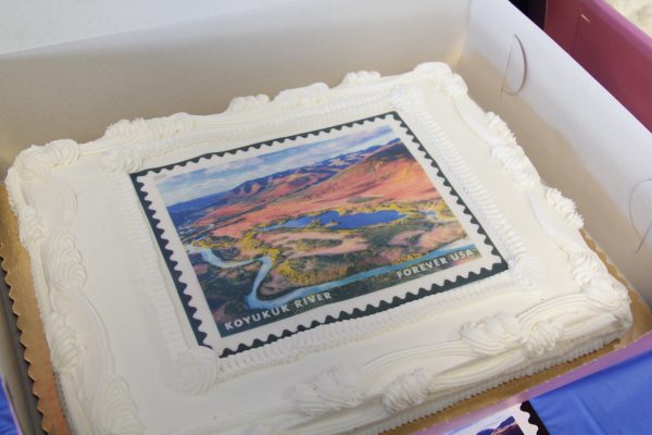 A cake features a print of the Koyukuk River at a USPS and NPS celebration of the stamps on May 29.