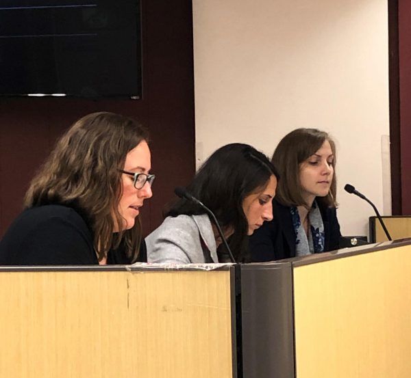 Jen Martell, of the FNSBSD Risk Management Team, updates the school board as Jill Dolan (center) and Wendy Dau (right) prepare to answer questions. (Photo by Robyne, KUAC - Fairbanks)