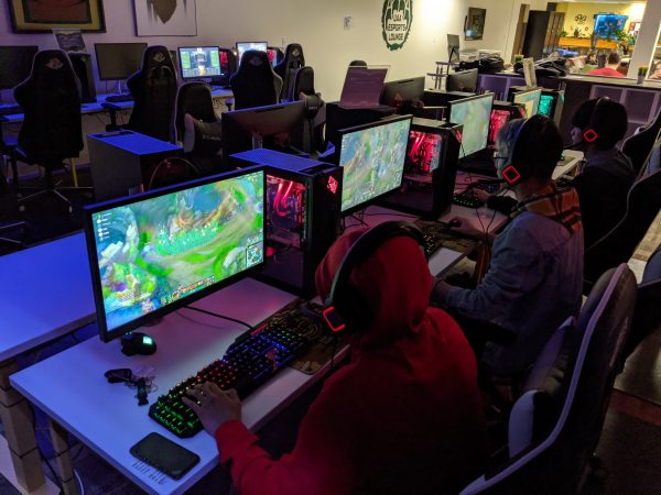 picture of three high school male students playing League of Legends in an eSports lounge at the University of Alaska Anchorage