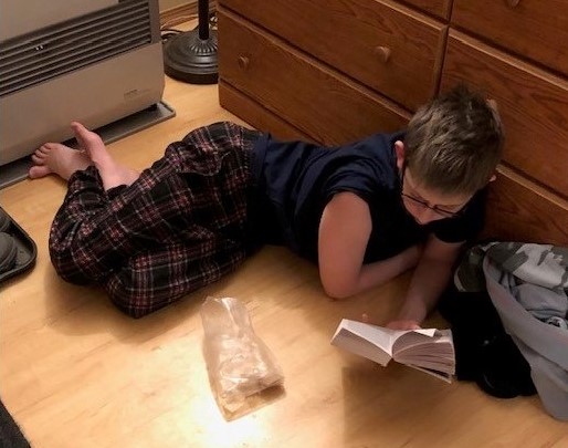 14-year-old Jack Roberts reads in his home. His mom Jamie homeschools him and his 16-year-old sister Renee. (Courtesy of Jamie Roberts)
