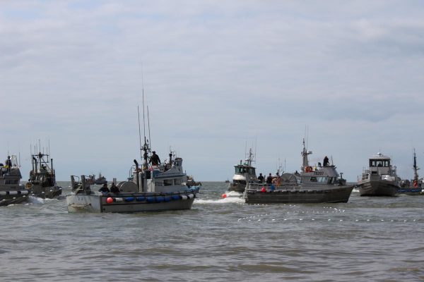 Several 30-foot fishing boatsin the water