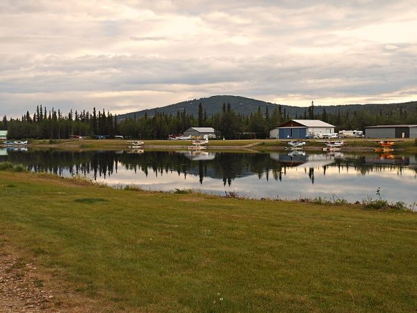 Float planes tied up in an artificial pond