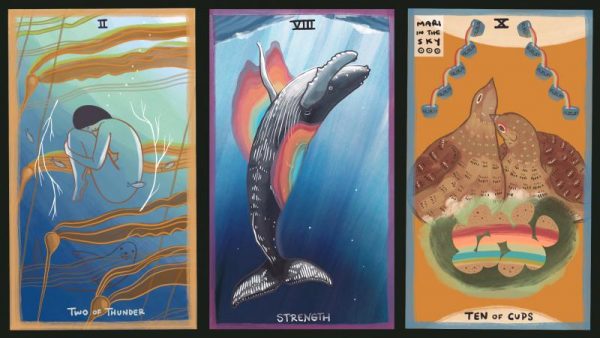 Three tarot cards next to each other one of a woman in childs pose under water, another of a humpback whale, and another o two birds in a nest.