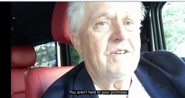 Man in car. Subtitle quotes him saying "you aren't held to your promises"
